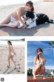 A woman in a white bikini posing with a dog on the beach.