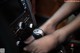 A close up of a person's hand on a gear stick.